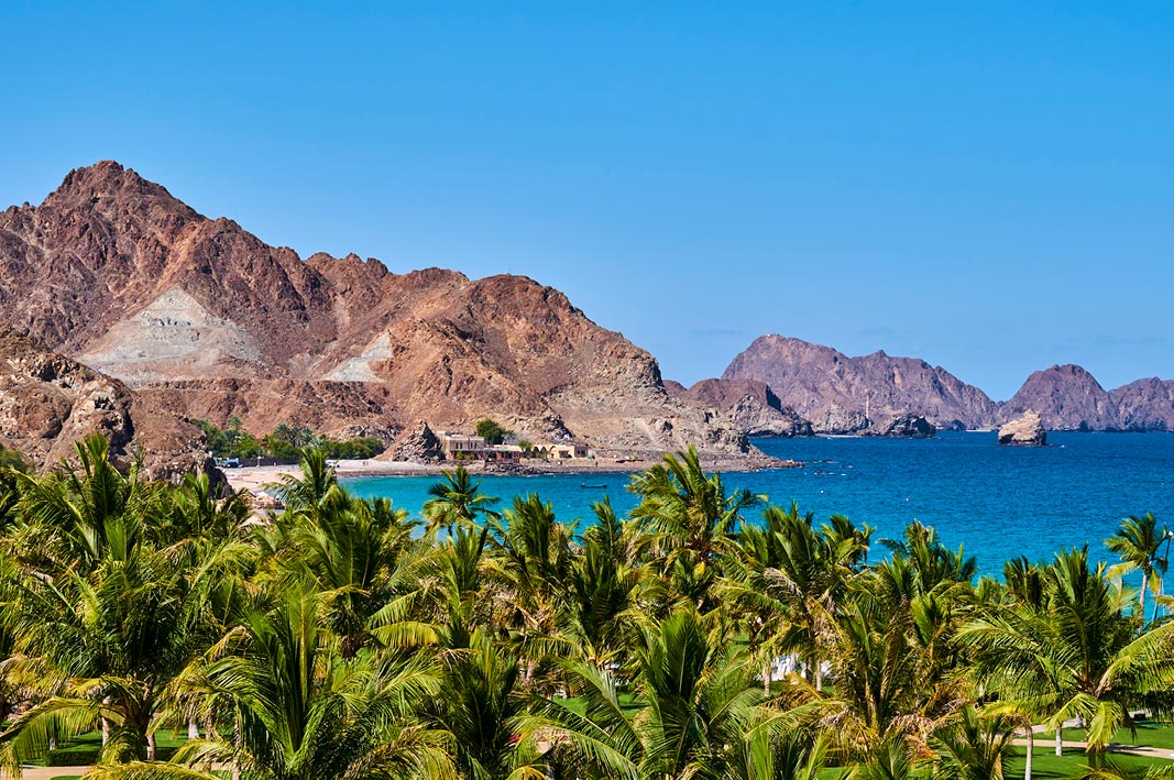 Expect picturesque mountain-framed beaches in Muscat, Oman.